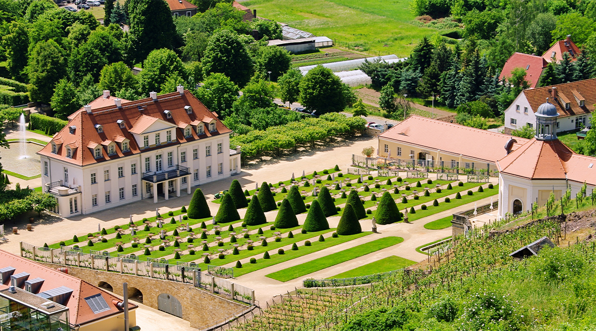 Winery buildings are dotted around an elegant ornamental garden